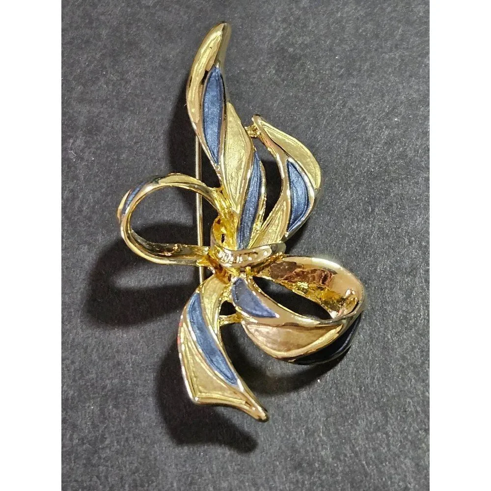 Vintage gold tone blue enamel bow brooch